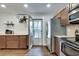 Bright kitchen features stainless steel fridge and stove, butcher block counters, hardwood floors, and access to patio at 2031 Audubon Ne Dr, Atlanta, GA 30329