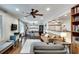 Spacious living room with hardwood floors, an open layout, and a built-in bookcase offering storage at 2031 Audubon Ne Dr, Atlanta, GA 30329