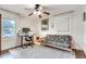 Well-lit home office space with hardwood floors, a futon and a large window at 2031 Audubon Ne Dr, Atlanta, GA 30329