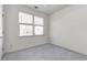 Carpeted bedroom featuring windows and natural light at 2119 Willow Chase Ct, Tucker, GA 30084