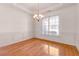 Bright dining area featuring wainscoting, chandelier, and a large window at 2119 Willow Chase Ct, Tucker, GA 30084