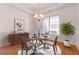 Bright dining area with wainscoting, chandelier, and natural light at 2119 Willow Chase Ct, Tucker, GA 30084