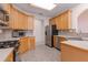 Well-equipped kitchen features stainless steel appliances and maple cabinetry at 2119 Willow Chase Ct, Tucker, GA 30084