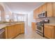 Bright kitchen with stainless steel appliances and view to dining area at 2119 Willow Chase Ct, Tucker, GA 30084