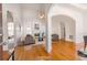 Bright living room with hardwood floors, fireplace, and arched doorways at 2119 Willow Chase Ct, Tucker, GA 30084