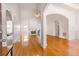 Bright living room featuring hardwood floors, fireplace, and arched doorways at 2119 Willow Chase Ct, Tucker, GA 30084