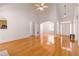 Hardwood floor living room with high ceilings, bright light, open to kitchen, breakfast, and front door at 2119 Willow Chase Ct, Tucker, GA 30084