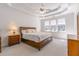 Main bedroom featuring a tray ceiling and large windows at 2119 Willow Chase Ct, Tucker, GA 30084