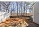 Backyard featuring patio, trees and minimal landscaping with a wooden privacy fence at 3326 Waldrop Trl, Decatur, GA 30034