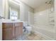 Bathroom featuring a vanity, toilet, and shower-tub combination at 3326 Waldrop Trl, Decatur, GA 30034