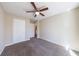 Bedroom with plush carpeting, neutral walls, a ceiling fan and ensuite access and closet at 3326 Waldrop Trl, Decatur, GA 30034