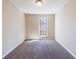 Neutral bedroom with neutral carpet, light-filled from window, offers serene and adaptable space at 3326 Waldrop Trl, Decatur, GA 30034