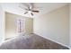 Bedroom featuring neutral walls, carpet and a window providing natural light, and ceiling fan at 3326 Waldrop Trl, Decatur, GA 30034