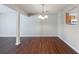 Well-lit dining area featuring hardwood floors and a view to the kitchen at 3326 Waldrop Trl, Decatur, GA 30034