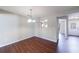 Hardwood-floor dining area with view to kitchen and doorway entrance at 3326 Waldrop Trl, Decatur, GA 30034