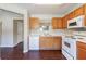 Functional kitchen featuring light wooden cabinets, a dishwasher, and essential appliances for meal preparation at 3326 Waldrop Trl, Decatur, GA 30034