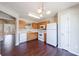 Open-concept kitchen boasting wooden cabinets, essential appliances, and a seamless transition to other spaces at 3326 Waldrop Trl, Decatur, GA 30034