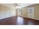 Spacious living room with hardwood floors and connecting to other rooms at 3326 Waldrop Trl, Decatur, GA 30034