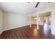 Large living room with hardwood floors, ceiling fan, and natural light at 3326 Waldrop Trl, Decatur, GA 30034