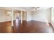 Bright living room with hardwood floors, ceiling fan, and view into dining area at 3326 Waldrop Trl, Decatur, GA 30034