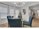 Dining space with stylish chandelier and many windows at 3893 Shelleydale Dr, Powder Springs, GA 30127