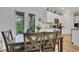 Bright dining area with natural light from the porch and views into the modern kitchen at 3895 Shelleydale Dr, Powder Springs, GA 30127