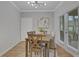 Cozy dining room featuring a modern light fixture, neutral paint, and natural light at 3895 Shelleydale Dr, Powder Springs, GA 30127