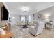 Comfortable living room featuring a cozy seating arrangement, modern decor, and a view into the well-lit entrance at 3893 Shelleydale Dr, Powder Springs, GA 30127