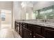 Bathroom featuring granite countertops, double sinks, and glass-enclosed shower at 4225 Sharpton Park Dr, Auburn, GA 30011