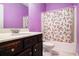 Functional bathroom with patterned shower curtain, sink, and toilet at 4225 Sharpton Park Dr, Auburn, GA 30011