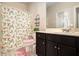 Bathroom with patterned shower curtain, vanity, and toilet at 4225 Sharpton Park Dr, Auburn, GA 30011