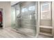 Modern bathroom featuring a glass-enclosed shower with tile surround and a built-in bench at 4225 Sharpton Park Dr, Auburn, GA 30011