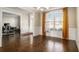 Bright dining room with hardwood floors, wainscoting, a chandelier, and window at 4225 Sharpton Park Dr, Auburn, GA 30011