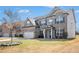 Beautiful two-story brick home with a manicured lawn and a spacious driveway at 4225 Sharpton Park Dr, Auburn, GA 30011