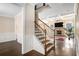 Inviting foyer with hardwood floors and stairs leading to the second floor at 4225 Sharpton Park Dr, Auburn, GA 30011