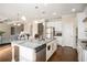 Bright eat-in kitchen featuring granite countertops, stainless steel appliances, and wooden floors at 4225 Sharpton Park Dr, Auburn, GA 30011