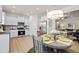 Open concept kitchen and dining area featuring stainless steel appliances and stylish lighting at 319 Skye Ln # 52, Cartersville, GA 30121