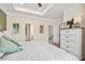 The main bedroom has a tray ceiling, carpeted floors, and white dresser for storage at 319 Skye Ln # 52, Cartersville, GA 30121