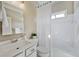 Bright bathroom featuring white vanity, shower-tub combination, and modern fixtures at 4125 Bridle Ridge Dr, Suwanee, GA 30024