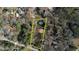 Aerial view of the property, outlined in yellow, amidst the surrounding neighborhood at 5500 Rockbridge Road, Stone Mountain, GA 30088