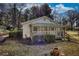 This home features a screened in porch and mature landscaping at 5500 Rockbridge Road, Stone Mountain, GA 30088