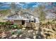 Charming home featuring a ramp to the front door, and lush greenery around the property at 5500 Rockbridge Road, Stone Mountain, GA 30088