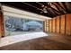 Spacious garage featuring a concrete floor and an open garage door showcasing the house at 5500 Rockbridge Road, Stone Mountain, GA 30088