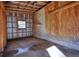 Inside the garage, showcasing a concrete floor, paneled walls, and a window at 5500 Rockbridge Road, Stone Mountain, GA 30088