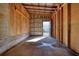 Interior view from inside the garage of concrete flooring and paneled walls at 5500 Rockbridge Road, Stone Mountain, GA 30088
