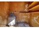 Showing an empty storage room with aged wall, shelves, and the water heater at 5500 Rockbridge Road, Stone Mountain, GA 30088