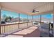 Enjoy outdoor relaxation on this covered porch with a swing and ceiling fan for added comfort at 108 Jasmine Way, Villa Rica, GA 30180