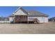 Lovely backyard featuring a spacious deck, covered patio, and a well-maintained lawn, perfect for outdoor entertaining at 108 Jasmine Way, Villa Rica, GA 30180