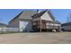 Charming backyard with a wooden deck, covered patio, and large lawn, offering a relaxing outdoor space at 108 Jasmine Way, Villa Rica, GA 30180
