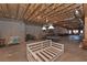 Unfinished basement with exposed wooden beams and concrete walls, presenting a customizable space with great potential at 108 Jasmine Way, Villa Rica, GA 30180